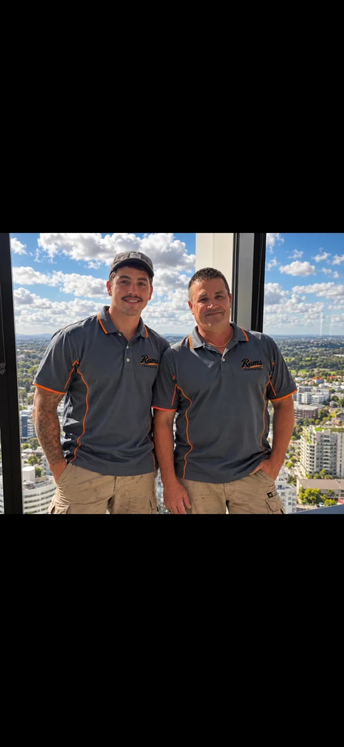 Rob and Riley Morris wearing RAMS Carpentry work shirts